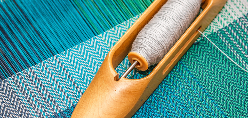 Blue threads on a loom
