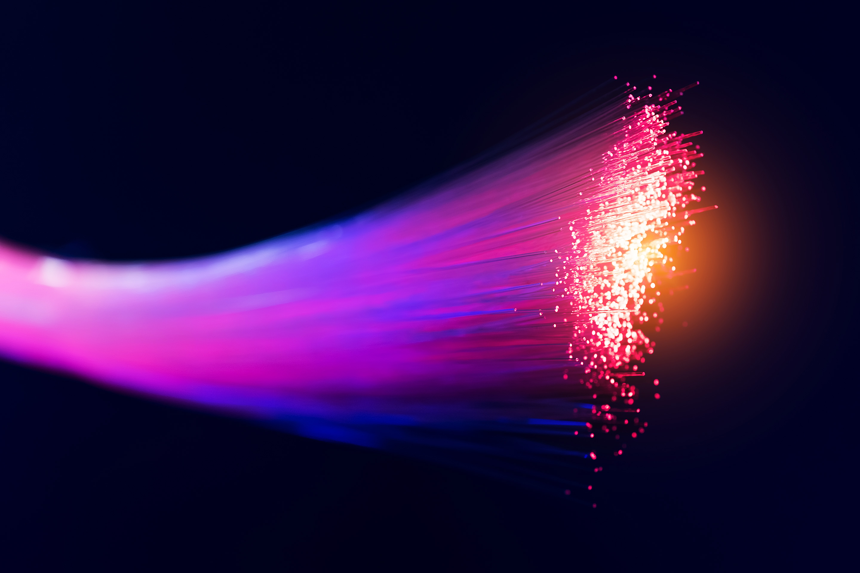 Pink, purple, and blue wires together spark a bright connection