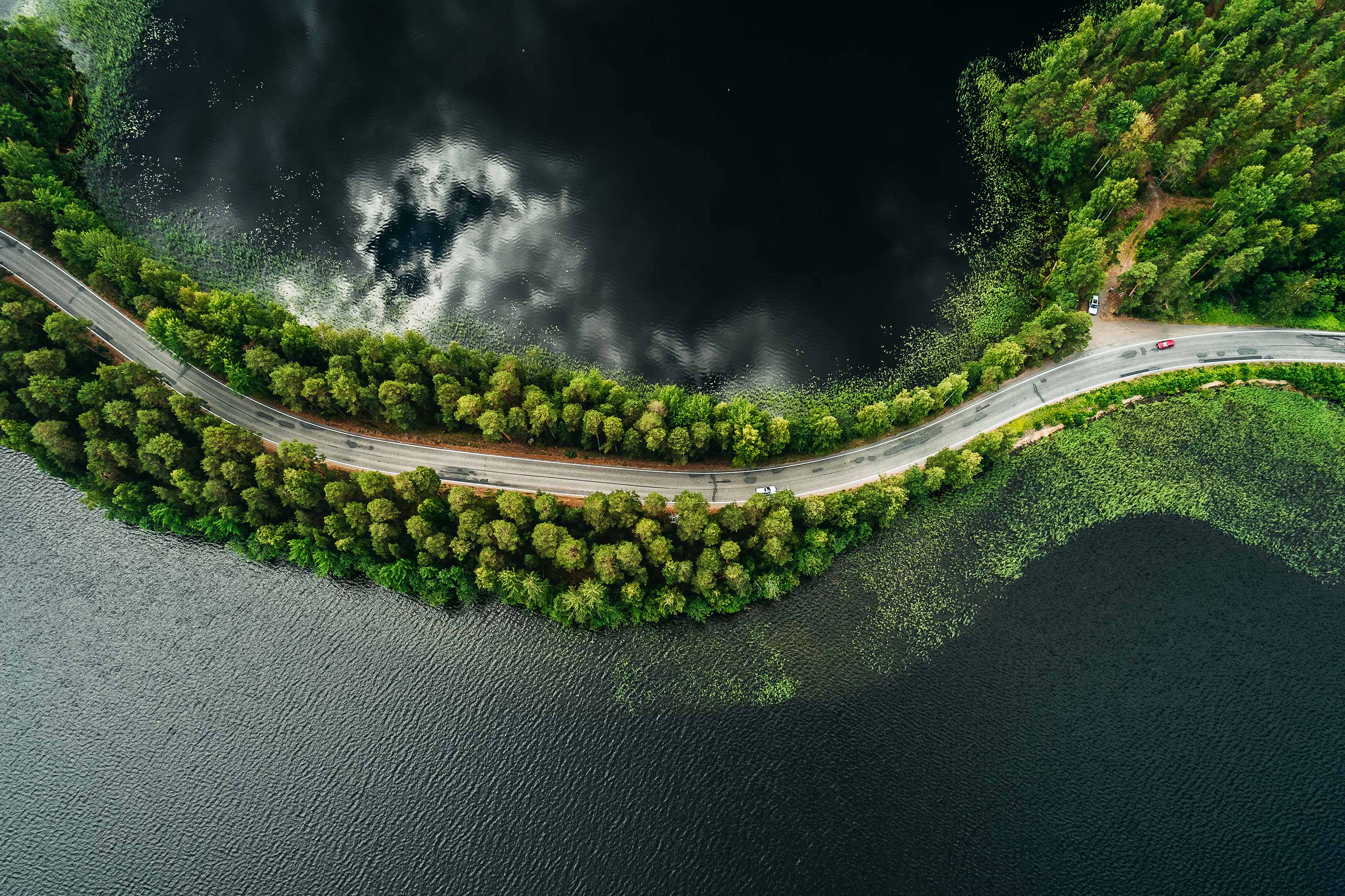 An overhead image of a road, with water on both sides, as a metaphor for connecting investment goals