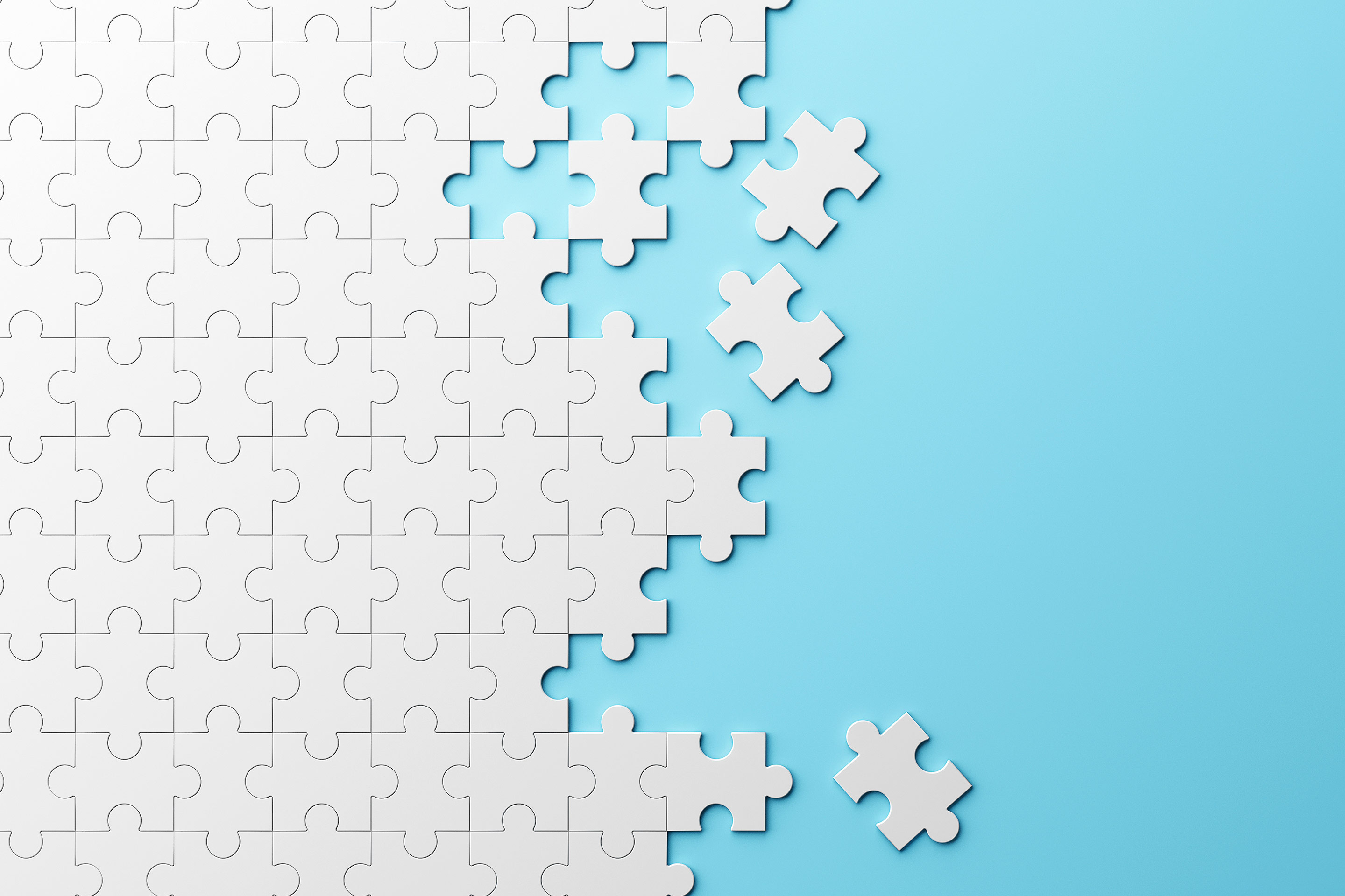 White puzzle pieces connect together across a blue background representing connectivity.