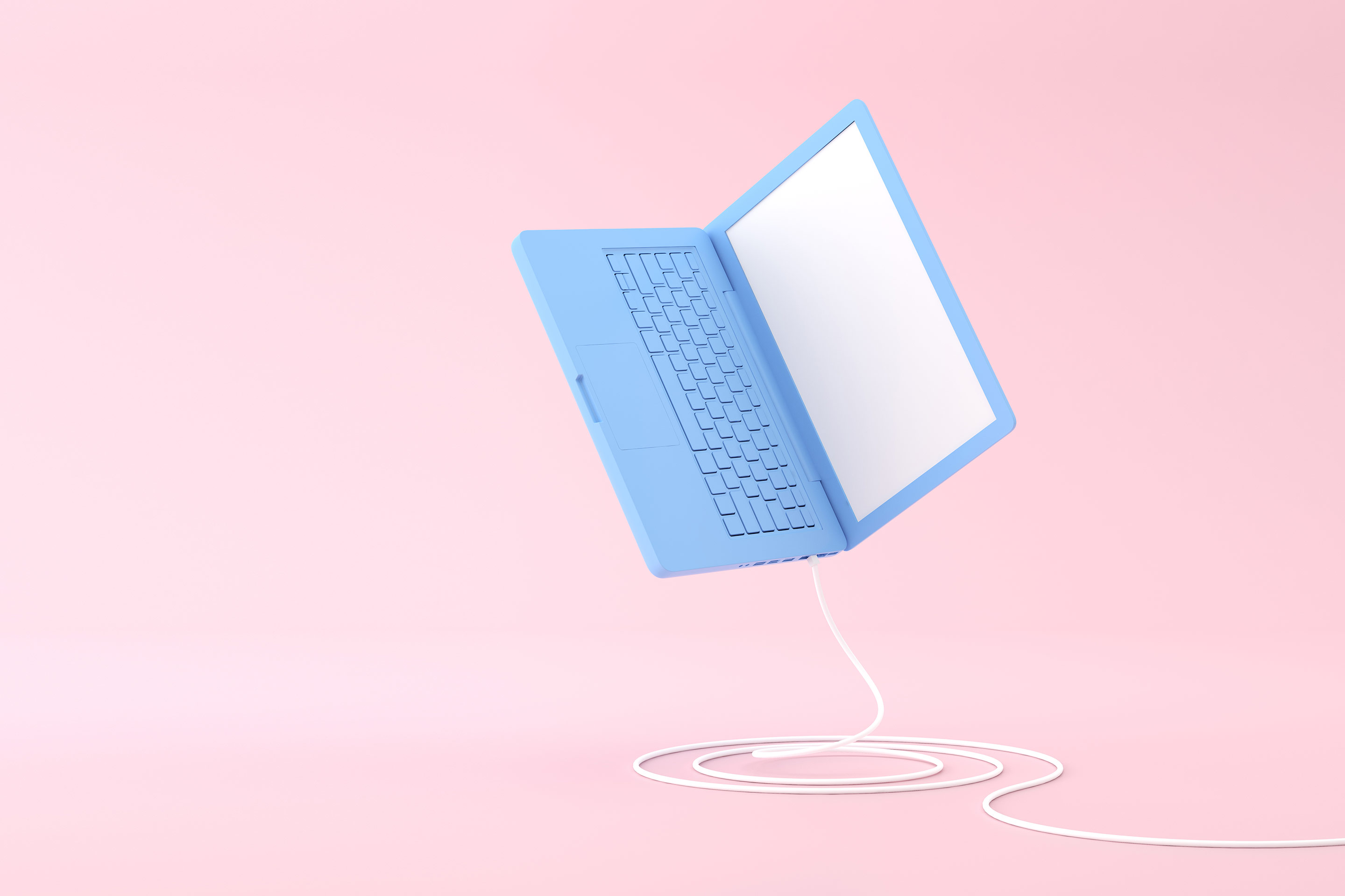 A blue laptop bounces across a pink background representing digitization