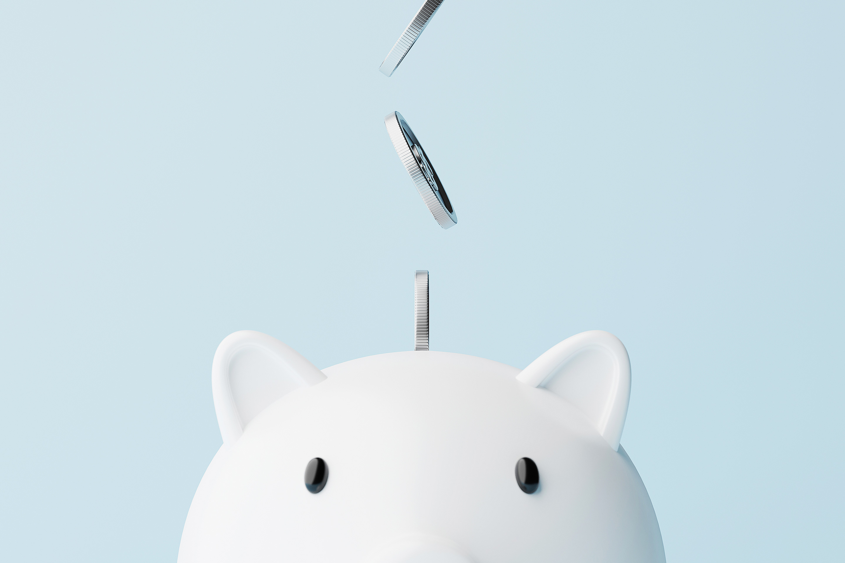 An image of coins falling into a piggy bank as a depiction of the benefits on financial planning