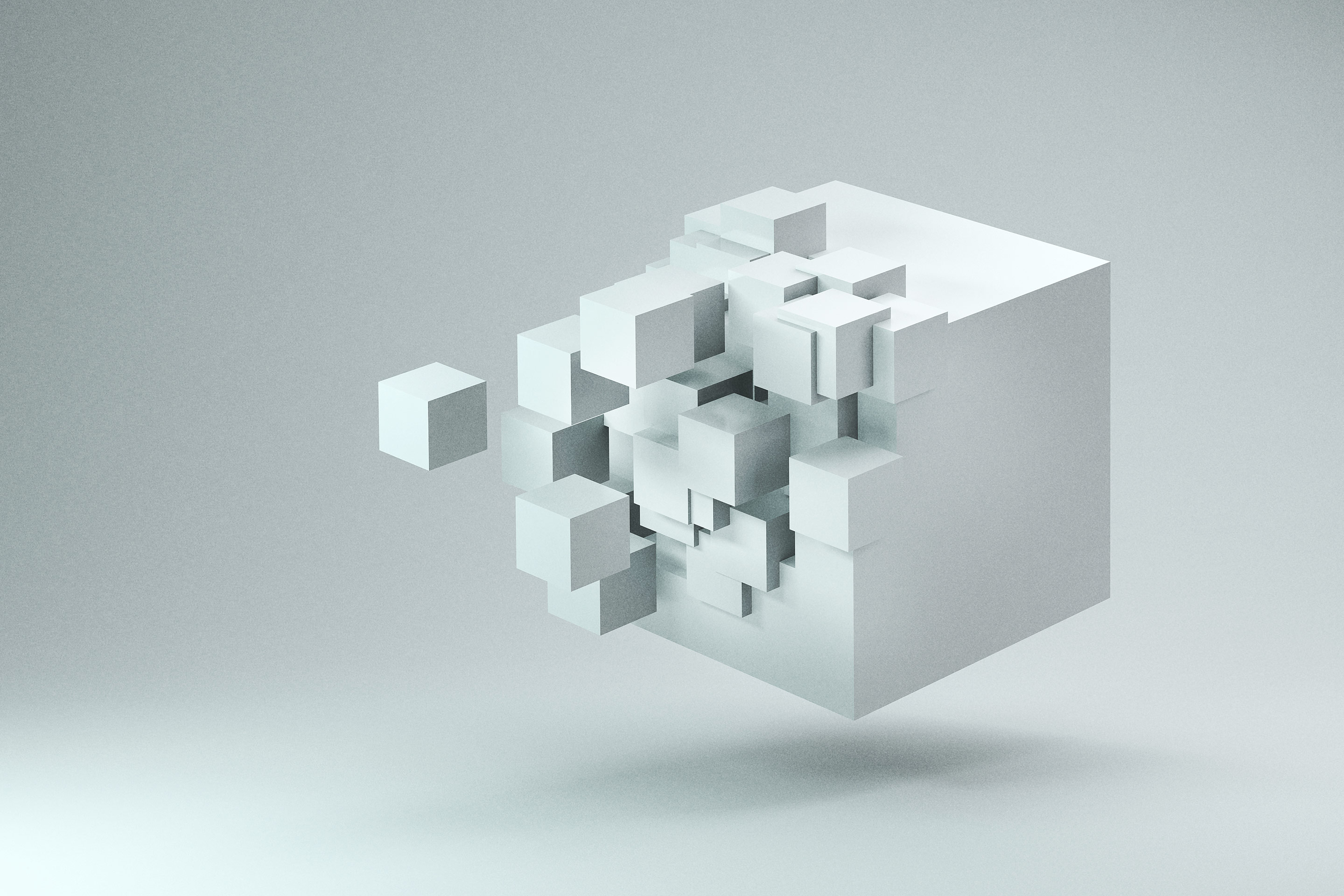 A curious white cube is partially constructed as it floats on a white background. It&#39;s either dissolving into smaller white 3D cubes, or being assembled by them.