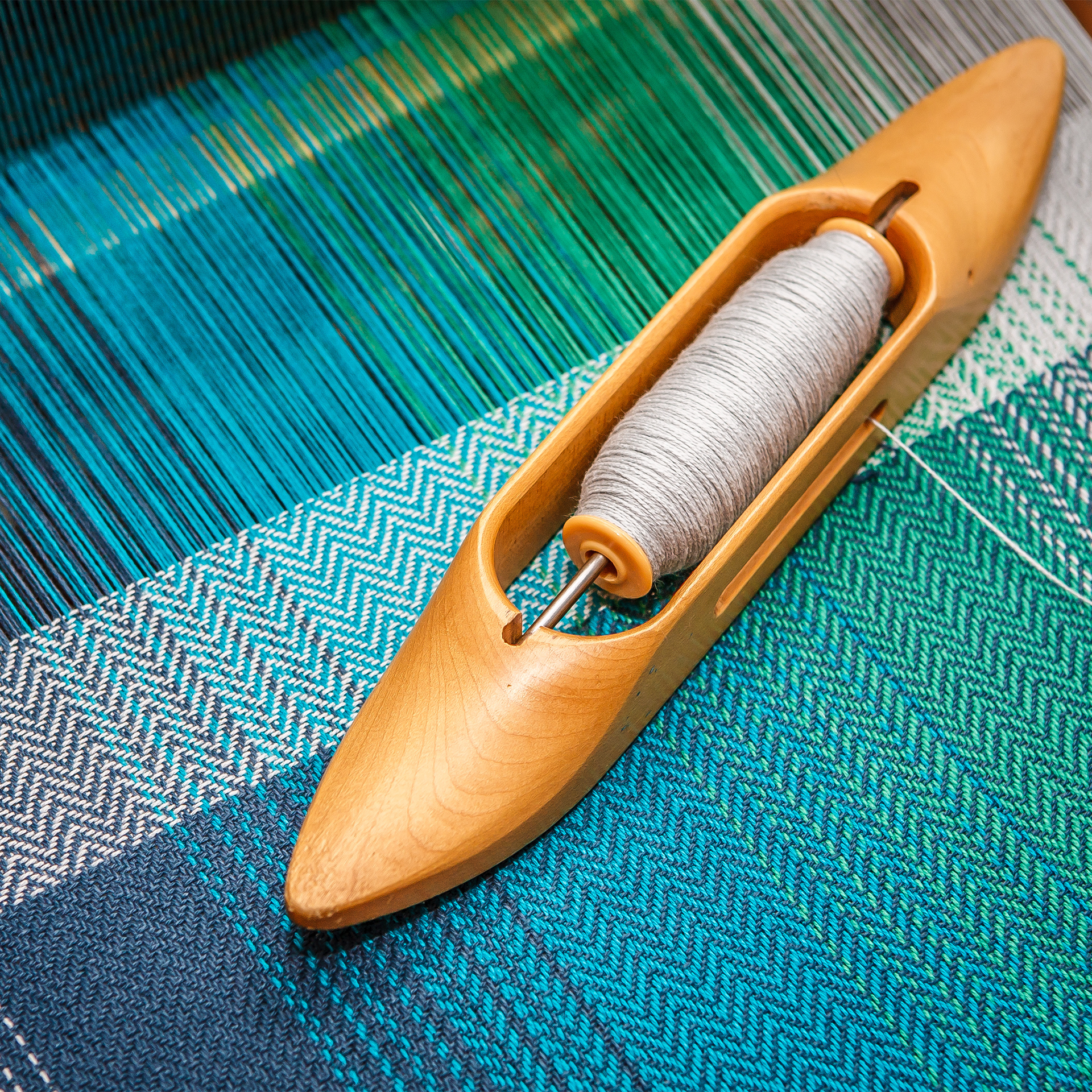 Blue threads on a loom