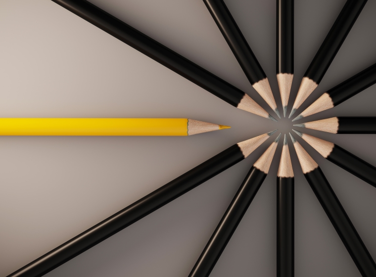 A yellow pencil interrupts a circle of black pencils, representing customization.