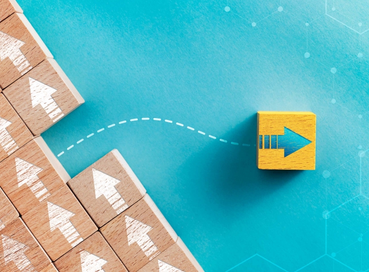 A wooden block with an arrow escapes from its row of other wooden blocks representing data flow