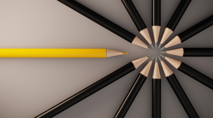 A yellow pencil interrupts a circle of black pencils, representing customization.