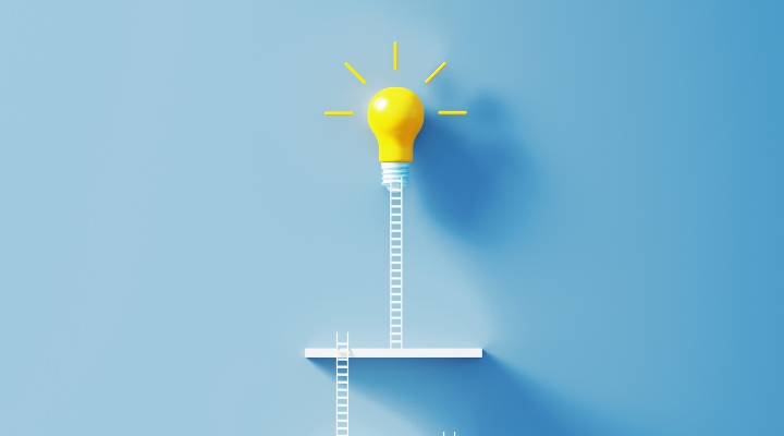 Small white ladders leading to a bright yellow lightbulb, creating a modern scene