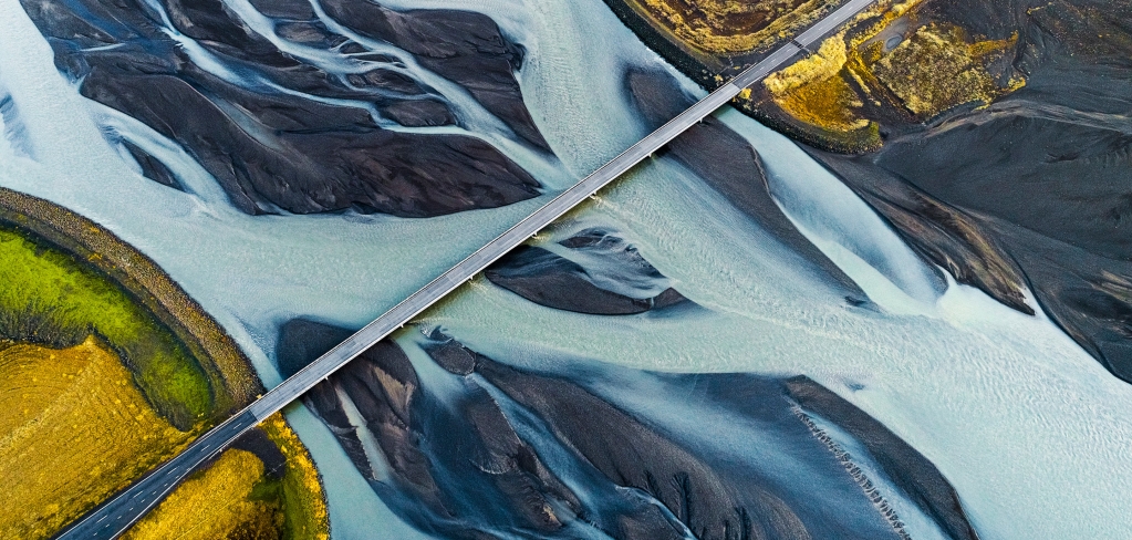 Aerial view of bridge over river.