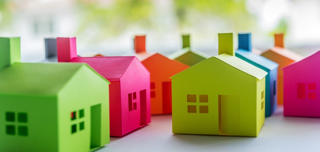 Colorful houses cluster together in a community.