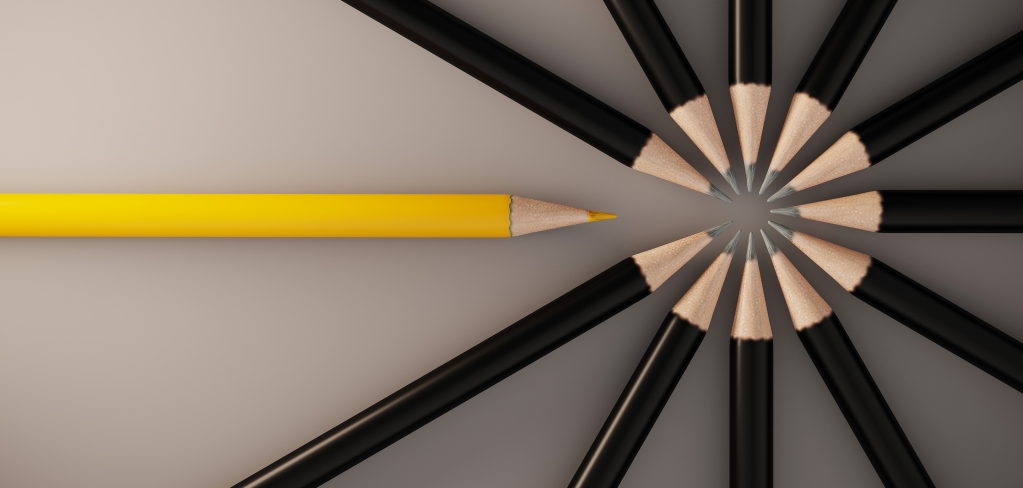 A yellow pencil interrupts a circle of black pencils, representing customization.