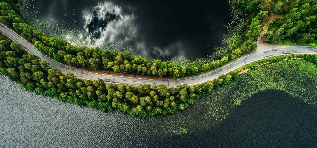 An overhead image of a road, with water on both sides, as a metaphor for connecting investment goals