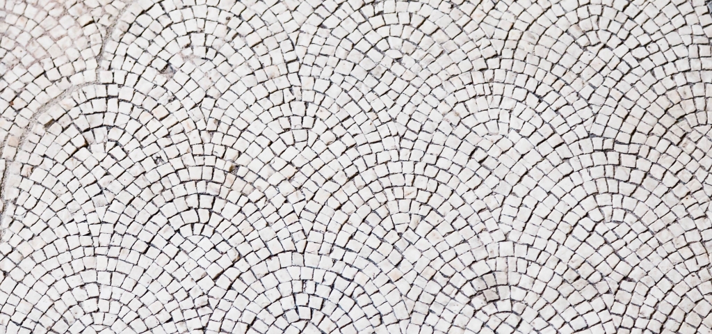 Overlapping stone tiles in a repeating pattern representing community.