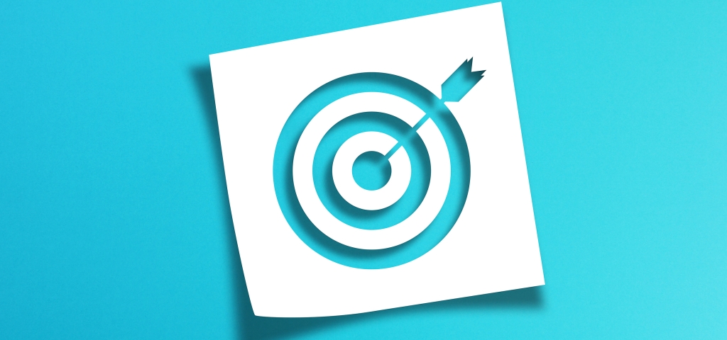 Image of a target on a vibrant blue background as a metaphor for investing goals