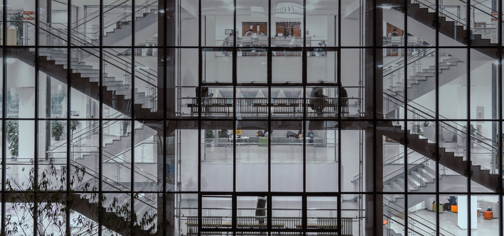 Outside view into windows of an office building staircase