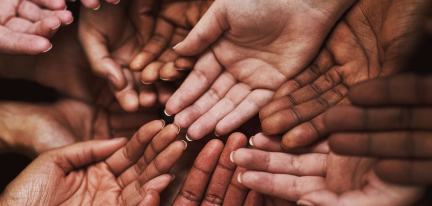 Many hands come together creating communities.