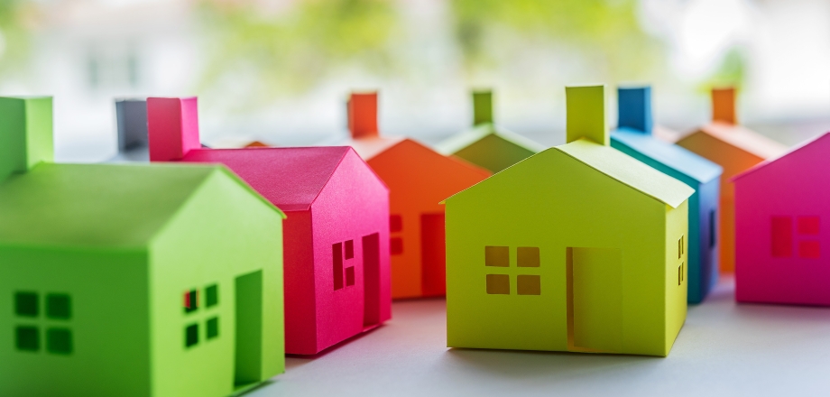 Colorful houses cluster together in a community.