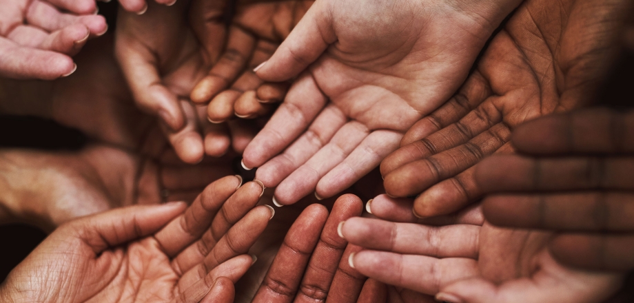 Many hands come together creating communities.