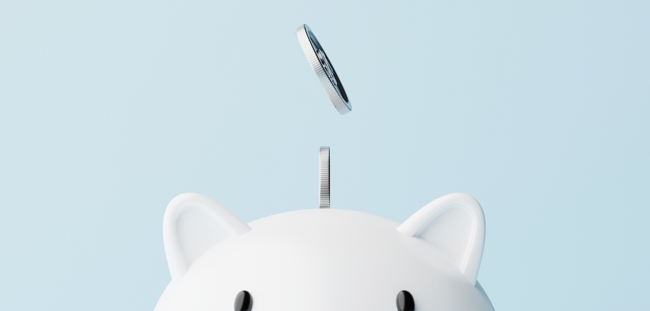 An image of coins falling into a piggy bank as a depiction of the benefits on financial planning