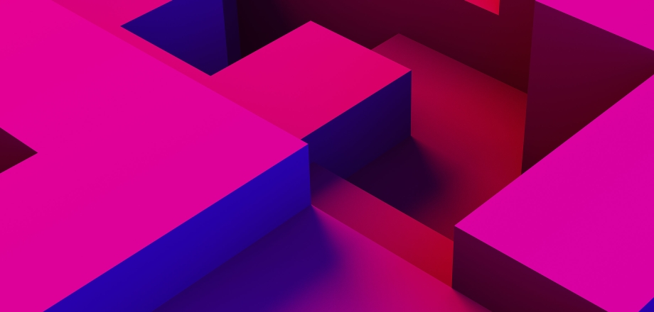 Brilliantly colored fuchsia and blue 3D block shapes seem to be coming together in an interconnecting pattern.