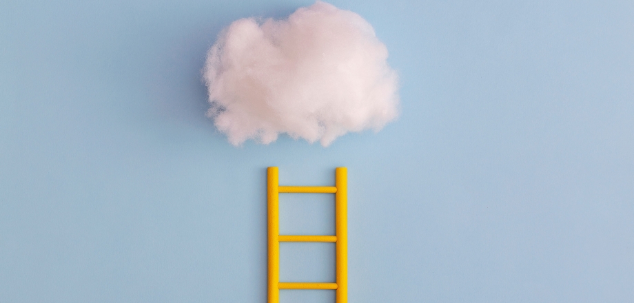 Image of bright yellow ladder reaching to a cotton cloud as a metaphor for reaching for investment returns and goals