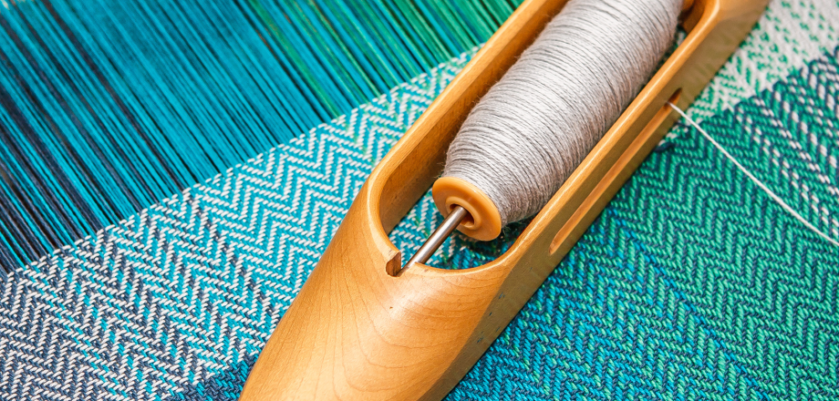 Blue threads on a loom