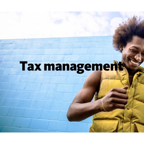 An athletic, stylish man laughing, wearing a bright yellow vest. overlaid with the words Tax management